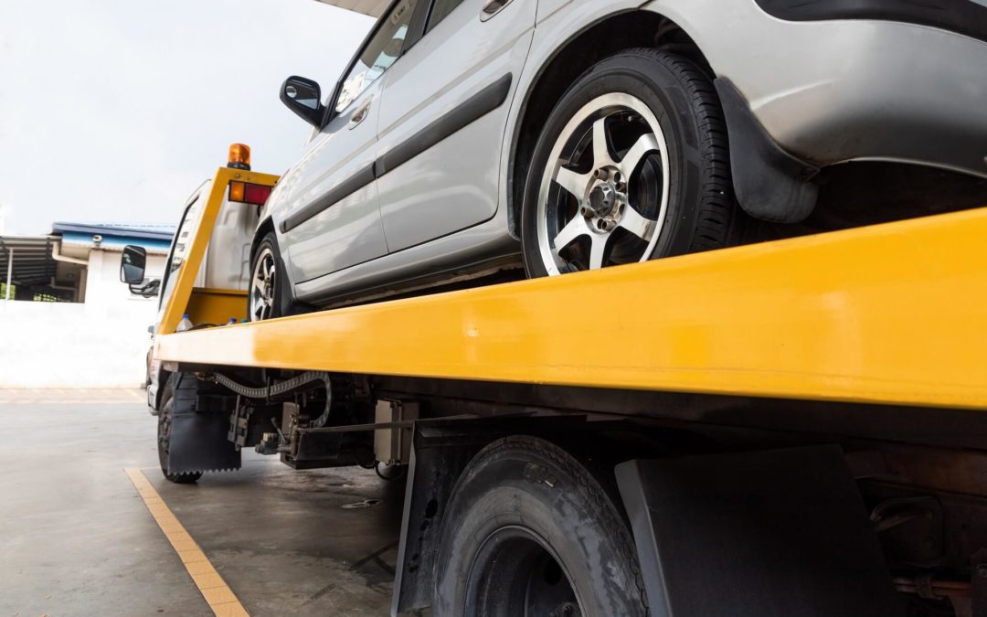Learn how to move your vehicle with a flatbed truck