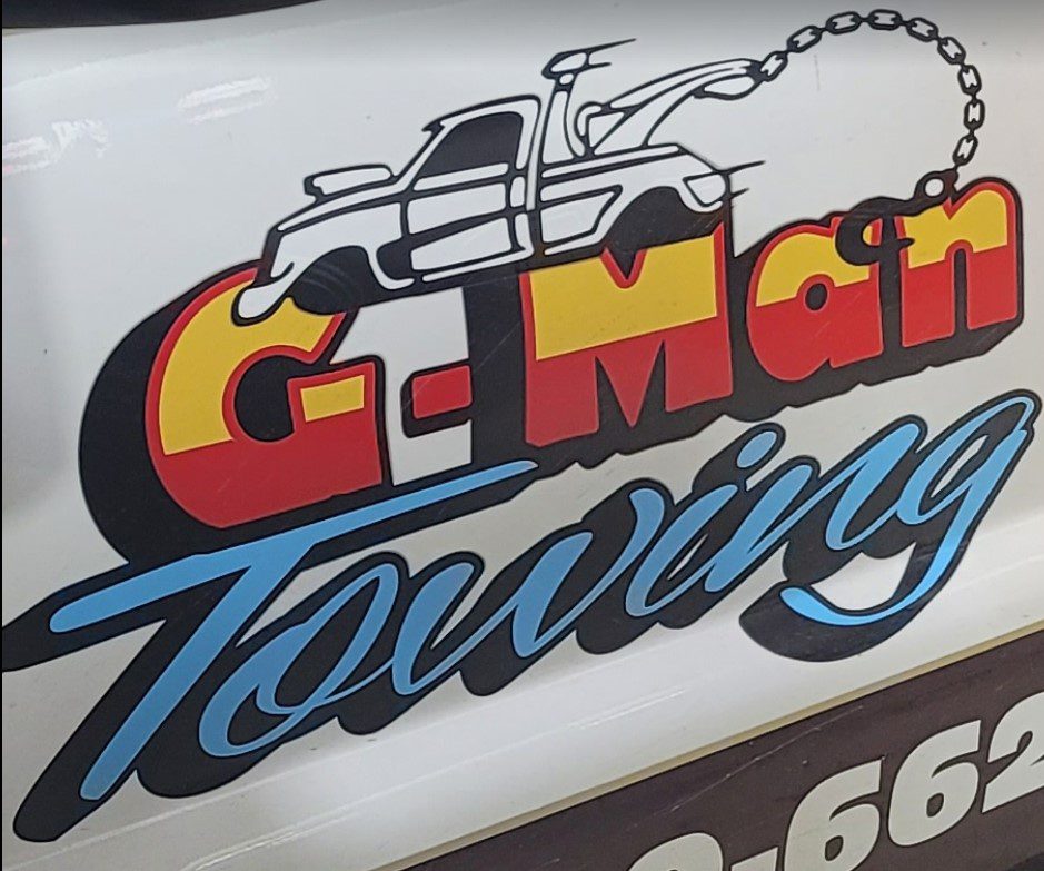 G-man towing logo truck